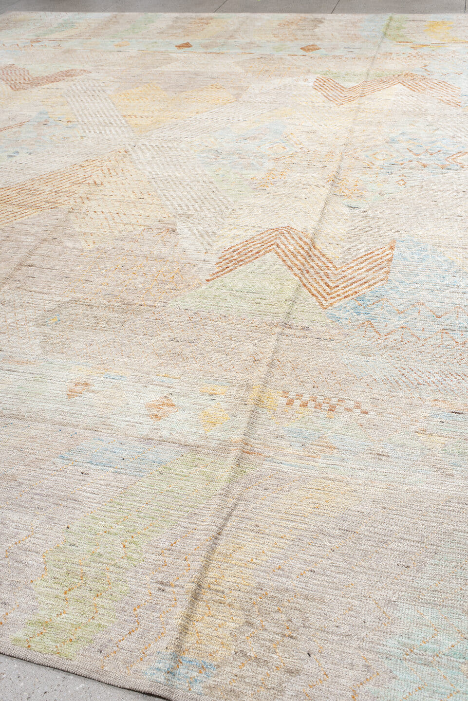 13' x 16' one-of-a-kind handmade vintage Tulu oversize rug. Color palette: ivory, peach, sky_blue, sage, soft_gold, taupe