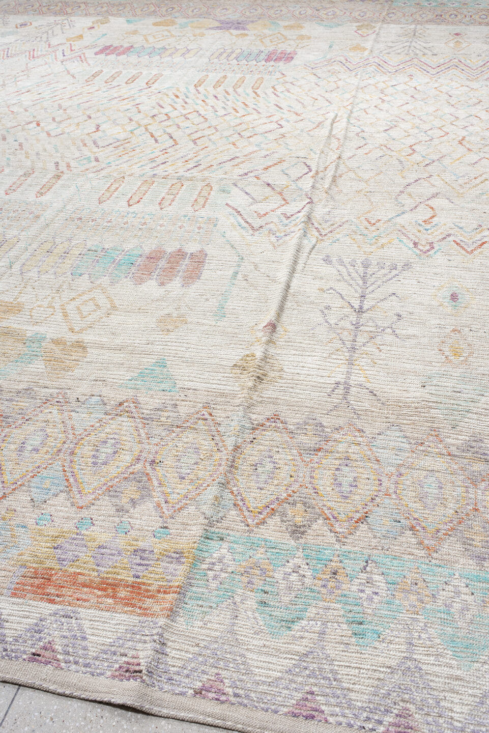 13' x 19' one-of-a-kind handmade vintage Tulu oversize rug. Color palette: ivory, lavender, aqua, blush, pale gold, taupe
