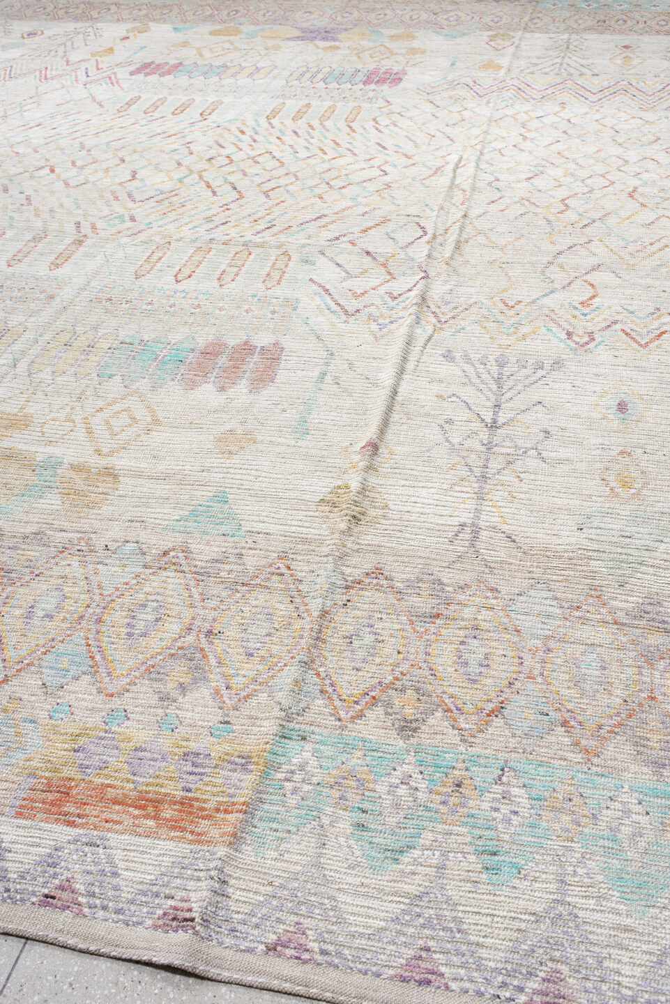 13' x 19' one-of-a-kind handmade vintage Tulu oversize rug. Color palette: ivory, lavender, aqua, blush, pale gold, taupe