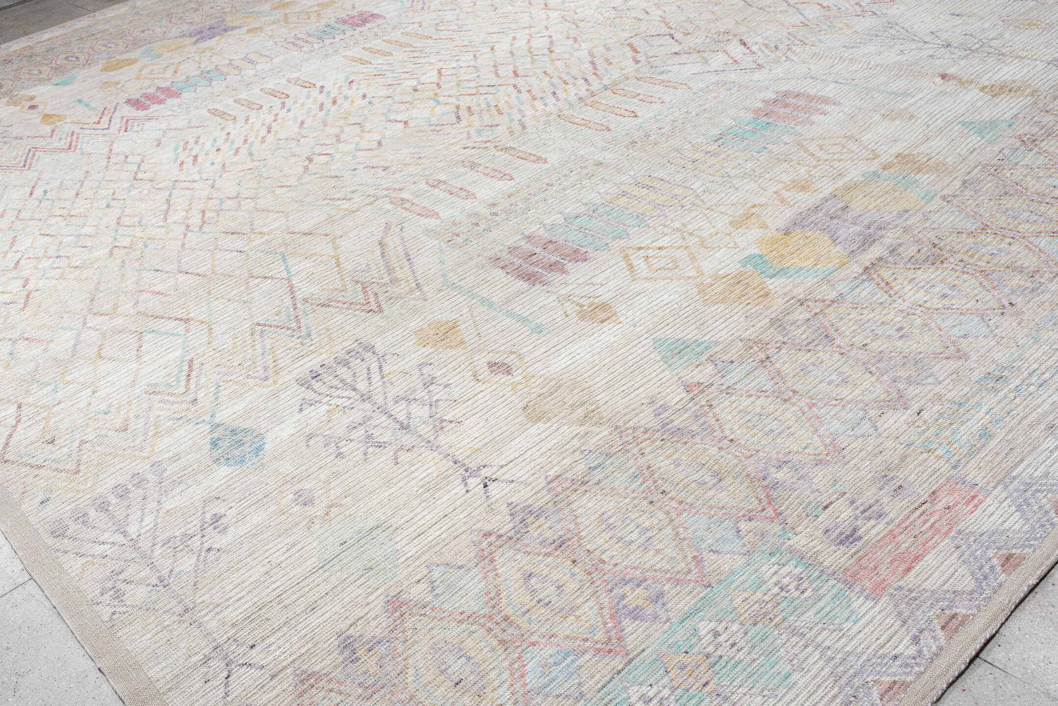 13' x 19' one-of-a-kind handmade vintage Tulu oversize rug. Color palette: ivory, lavender, aqua, blush, pale gold, taupe