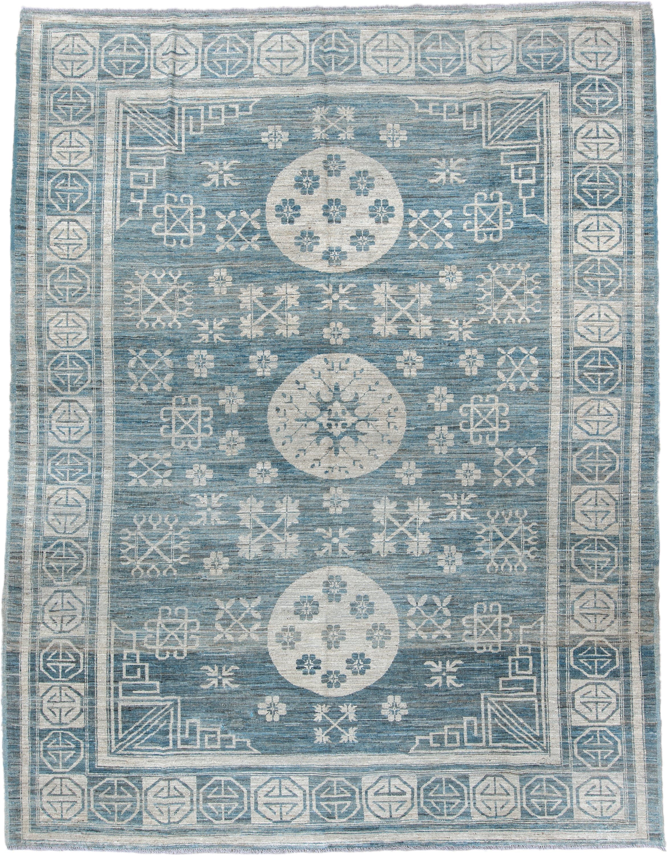 9' x 11' one-of-a-kind handmade vintage Khotan large size rug. Color palette: sky blue, ivory, slate, cream, light blue