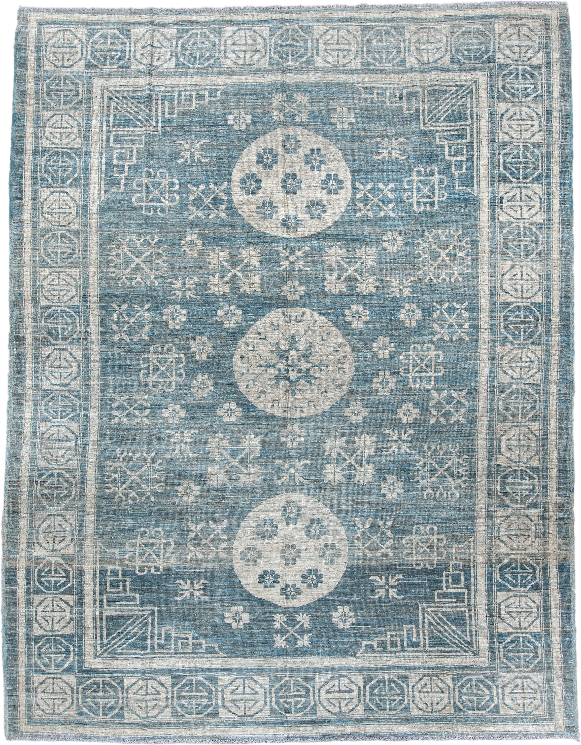 9' x 11' one-of-a-kind handmade vintage Khotan large size rug. Color palette: sky blue, ivory, slate, cream, light blue