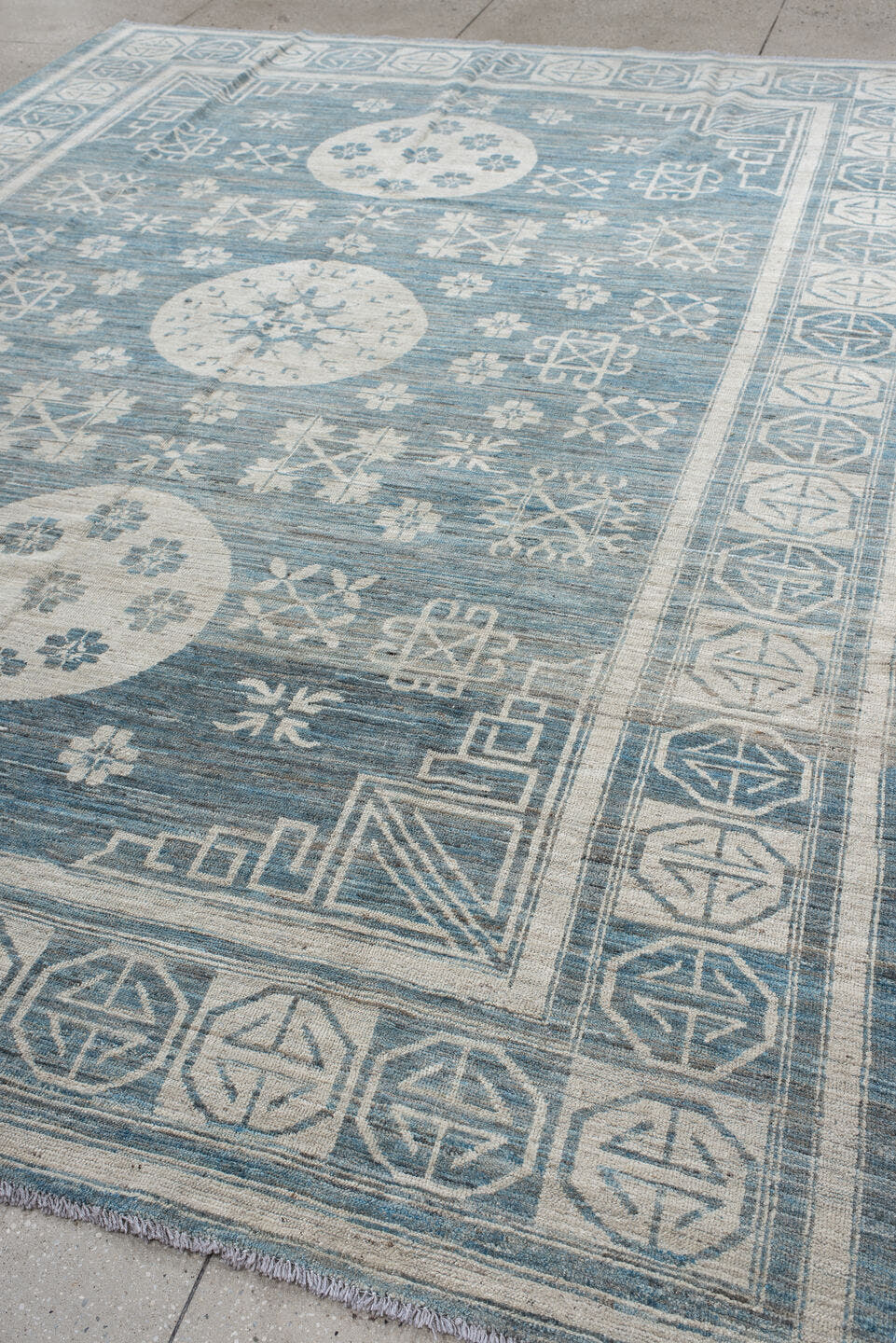 9' x 11' one-of-a-kind handmade vintage Khotan large size rug. Color palette: sky blue, ivory, slate, cream, light blue