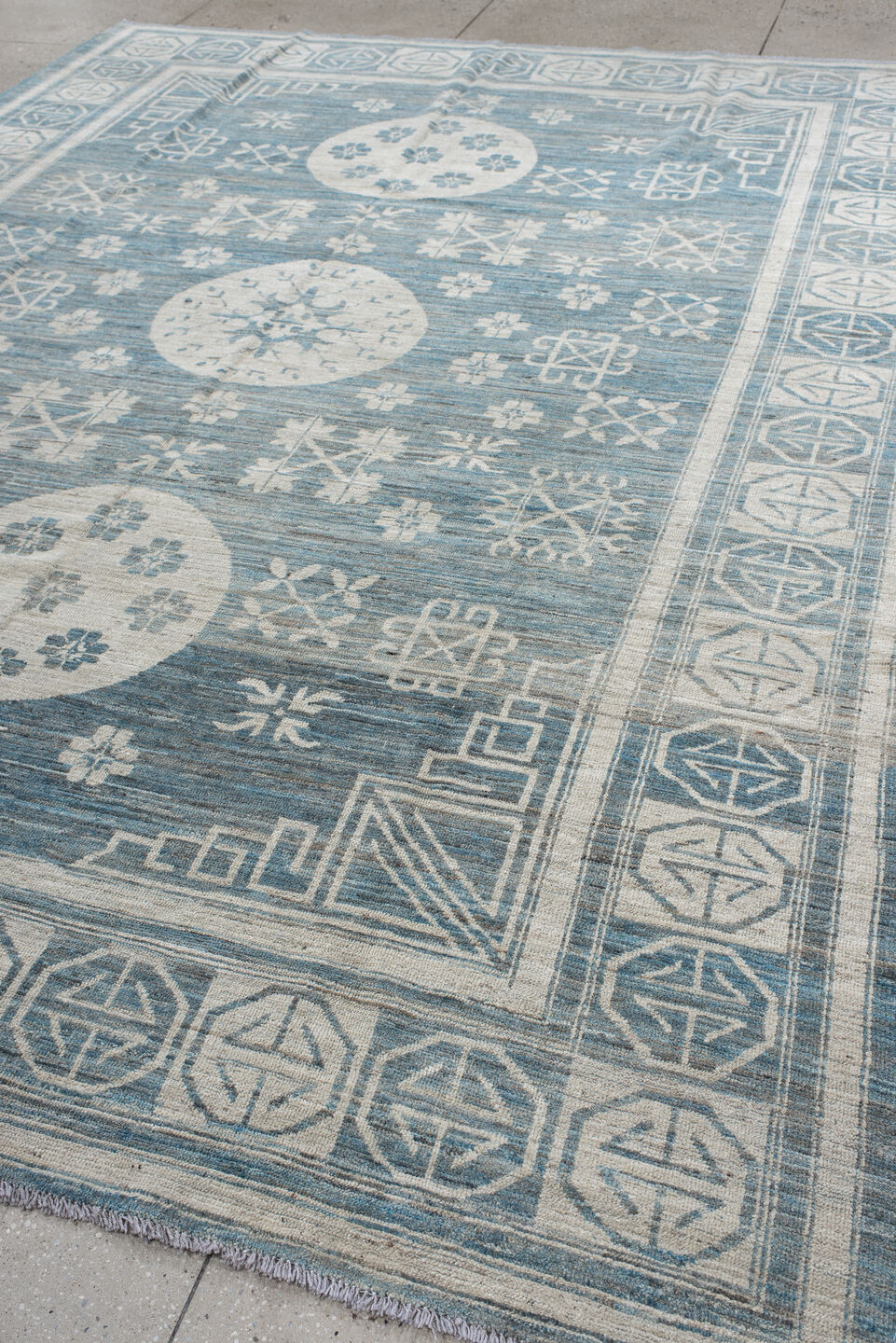 9' x 11' one-of-a-kind handmade vintage Khotan large size rug. Color palette: sky blue, ivory, slate, cream, light blue