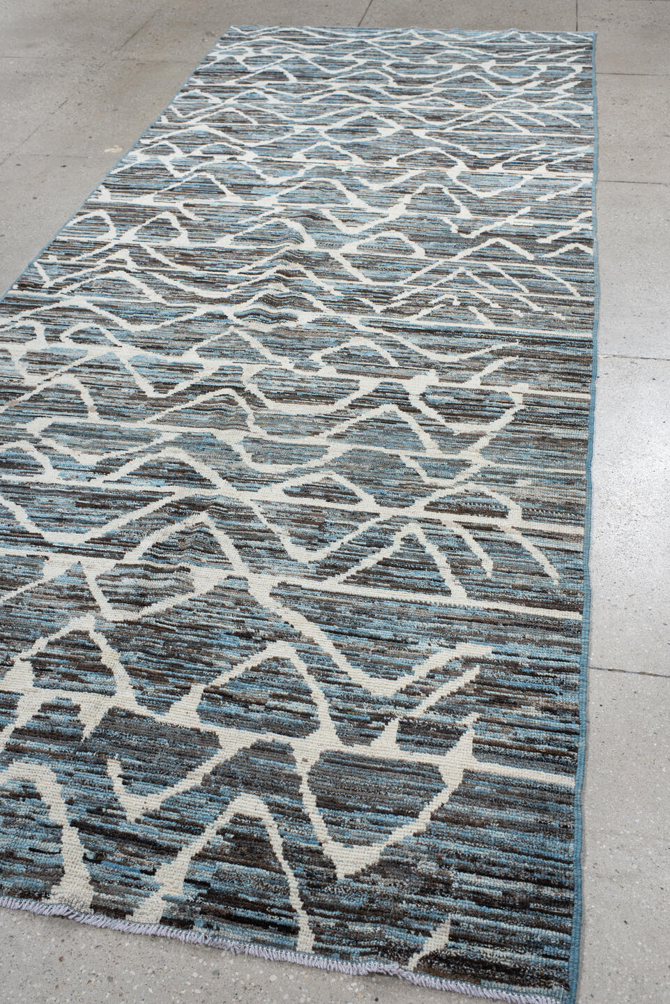 5' x 12' one-of-a-kind handmade vintage Tulu runner rug. Color palette: blue, charcoal, ivory, slate, gray, black