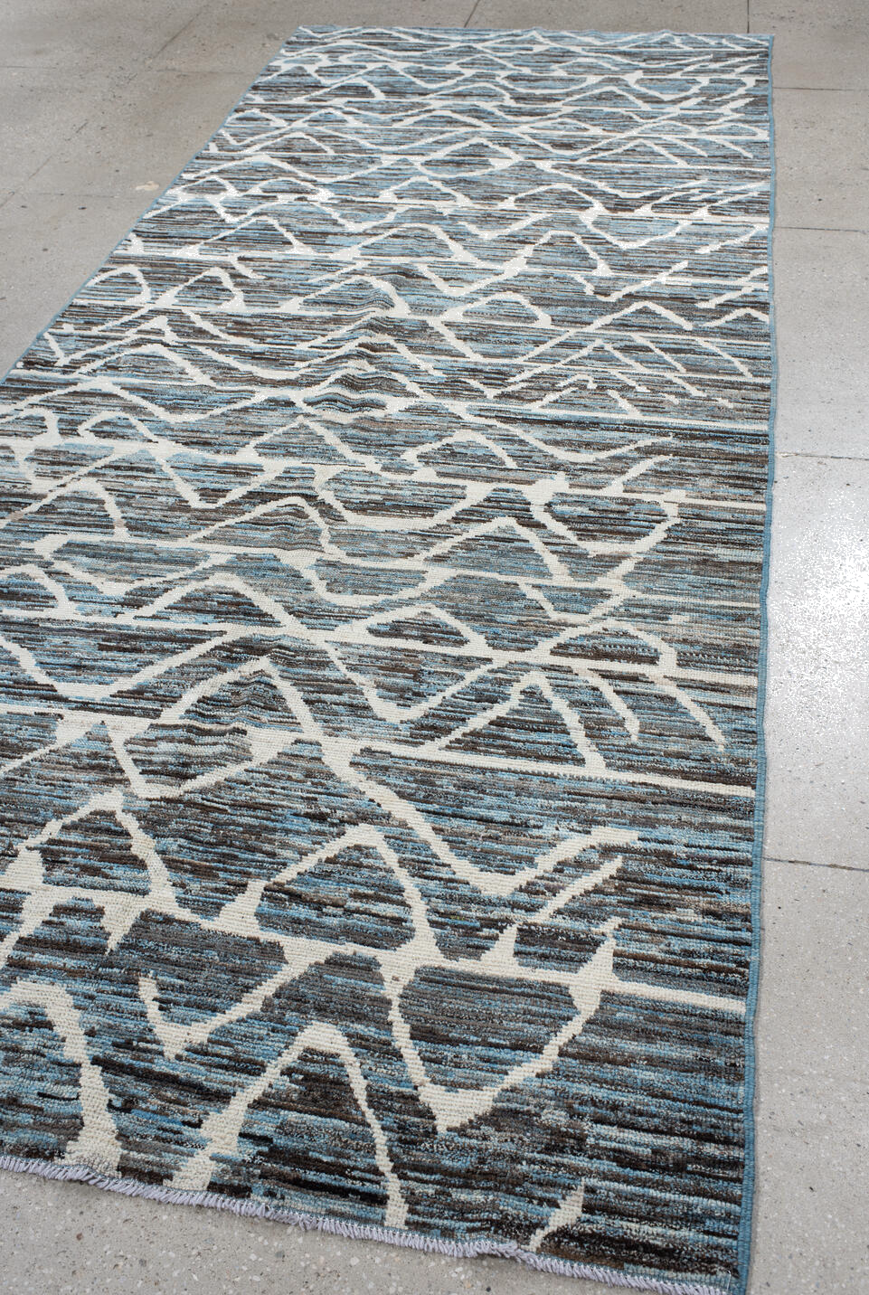 5' x 12' one-of-a-kind handmade vintage Tulu runner rug. Color palette: black, blue, charcoal, dark gray, dim gray