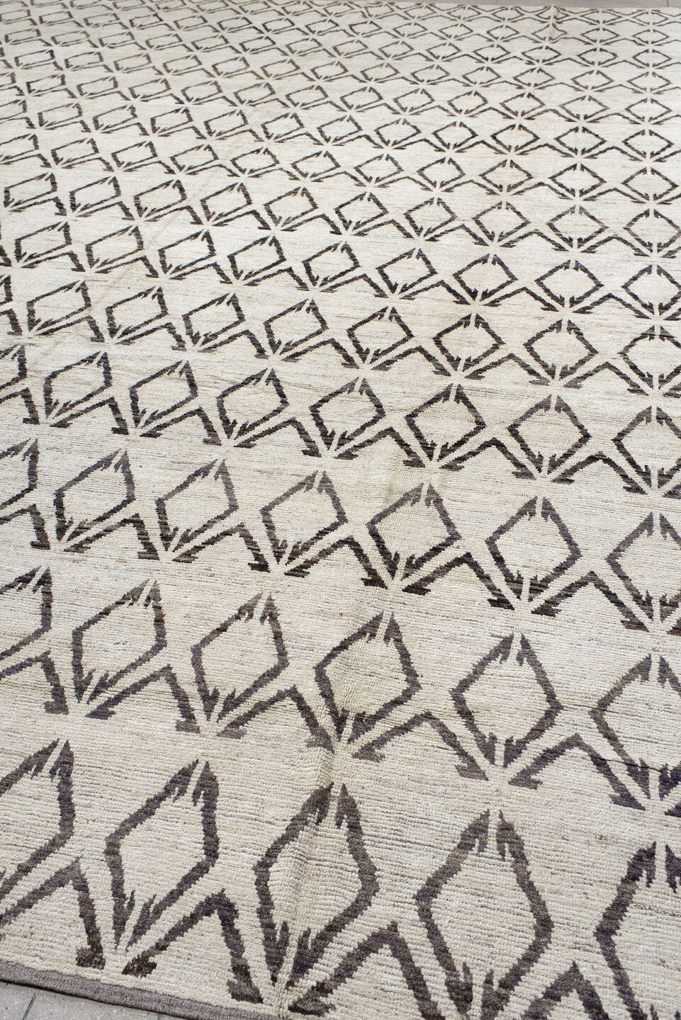 14' x 19' one-of-a-kind handmade vintage Tulu oversize rug. Color palette: ivory, charcoal, taupe, gray, black, beige