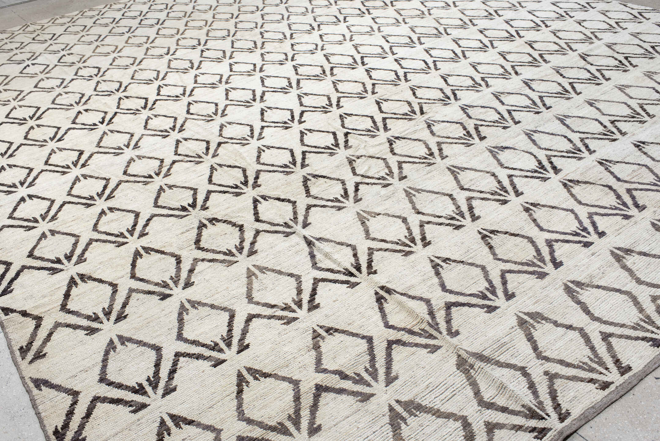 14' x 19' one-of-a-kind handmade vintage Tulu oversize rug. Color palette: ivory, charcoal, taupe, gray, black, beige