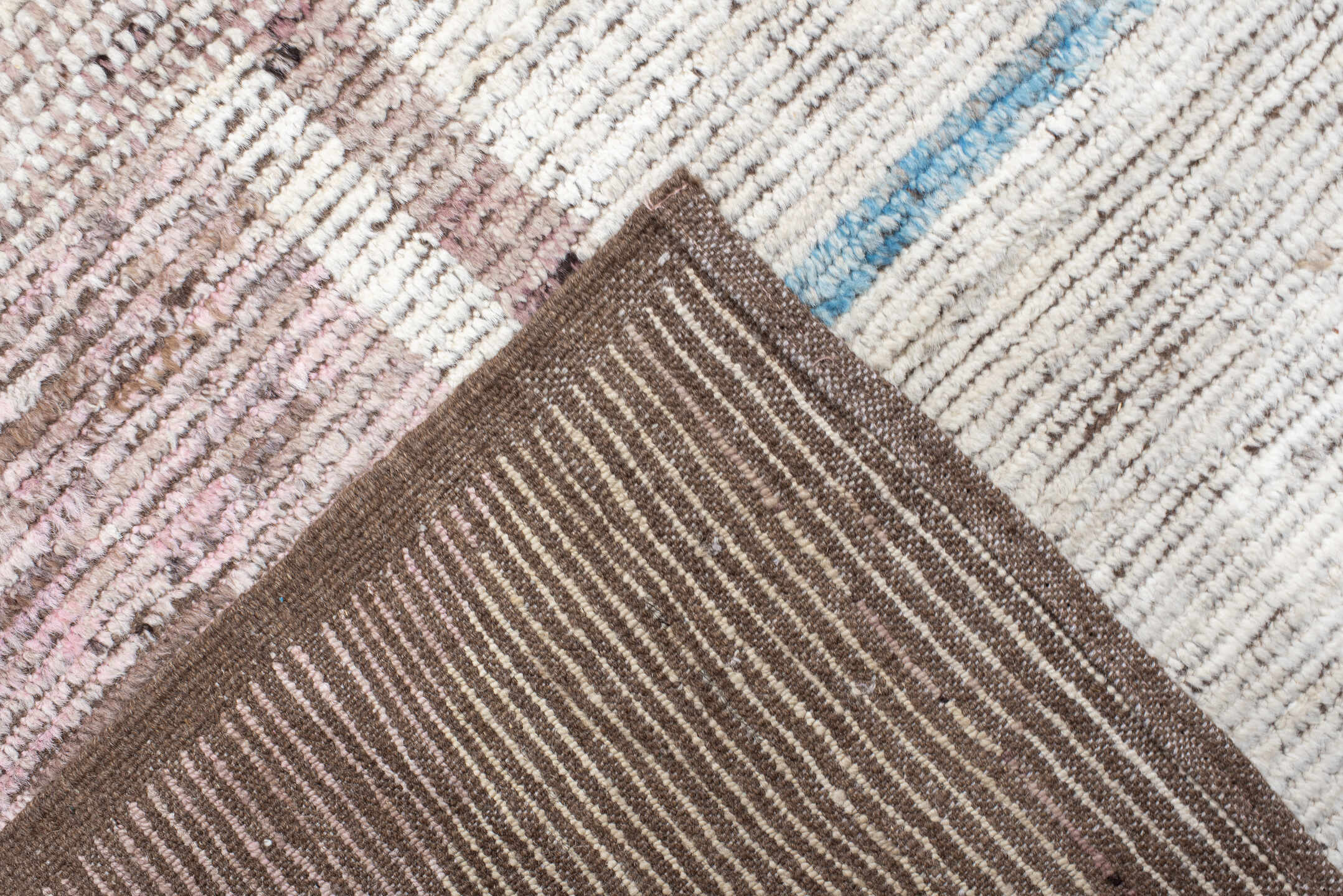 16' x 20' one-of-a-kind handmade vintage Tulu oversize rug. Color palette: ivory, rust, blush, sky blue, soft gold, taupe