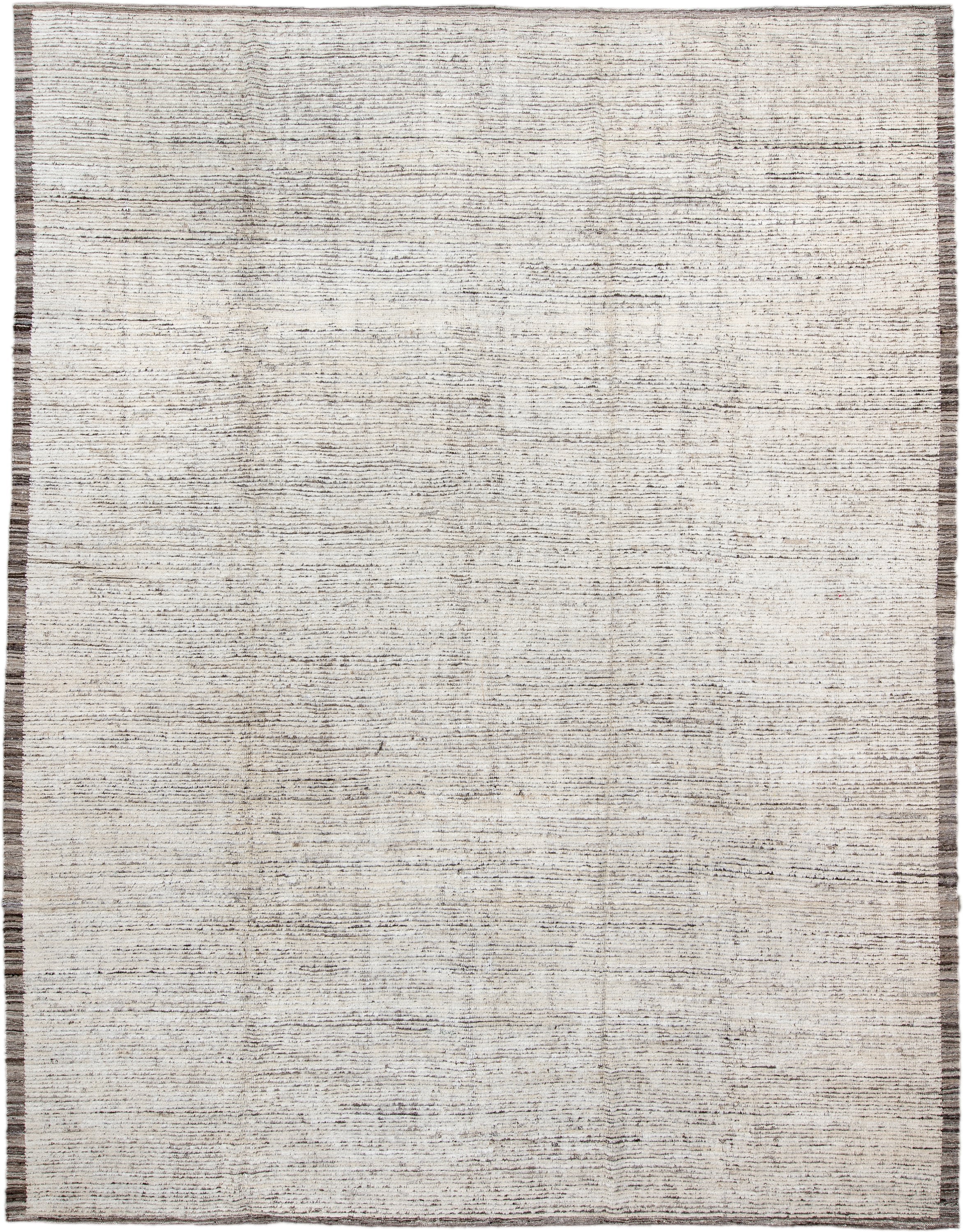 10' x 13' one-of-a-kind handmade vintage Tulu large size rug. Color palette: ivory, charcoal, taupe, brown, gray, black