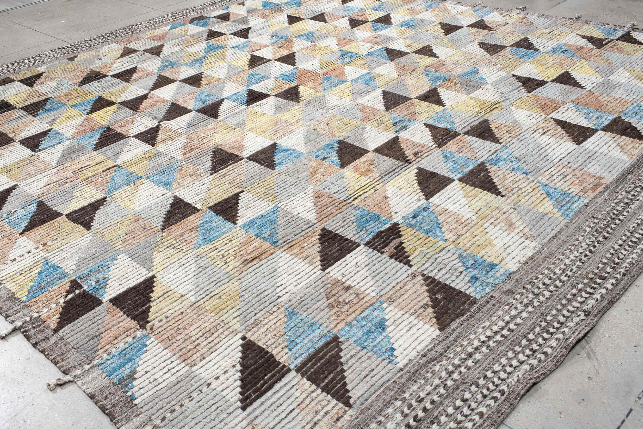 13' x 14' one-of-a-kind handmade vintage Tulu oversize rug. Color palette: ivory, gray, charcoal, sky blue, pale yellow