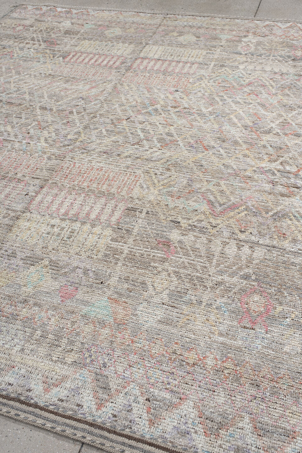 8' x 9' one-of-a-kind handmade vintage Tulu rug. Color palette: ivory, taupe, gray, blush, pale blue, charcoal, cream, coral