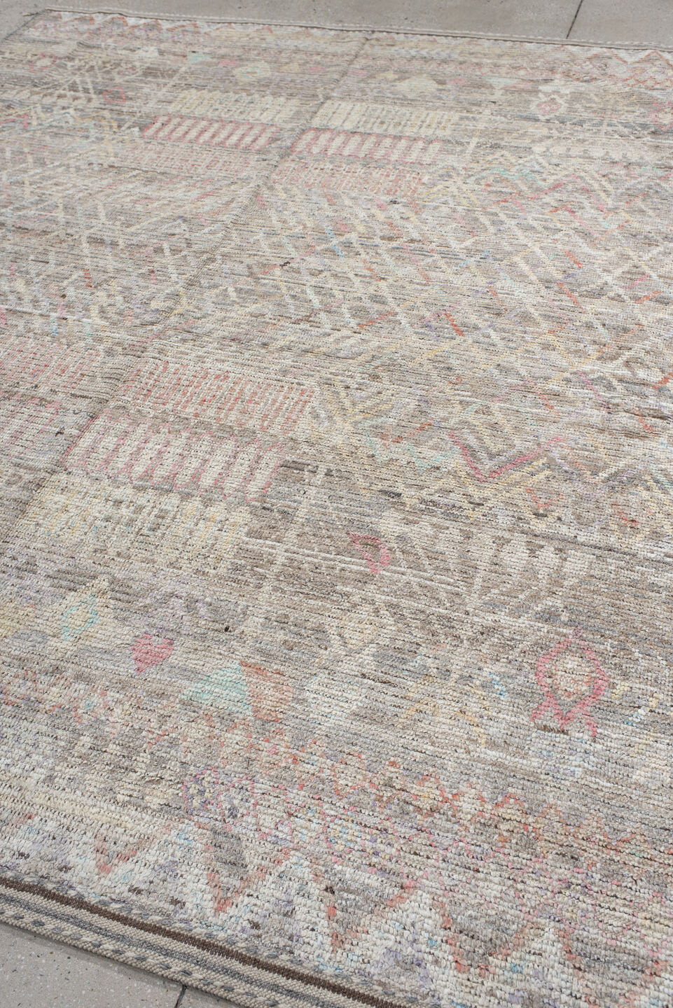 8' x 9' one-of-a-kind handmade vintage Tulu rug. Color palette: ivory, taupe, gray, blush, pale blue, charcoal, cream, coral