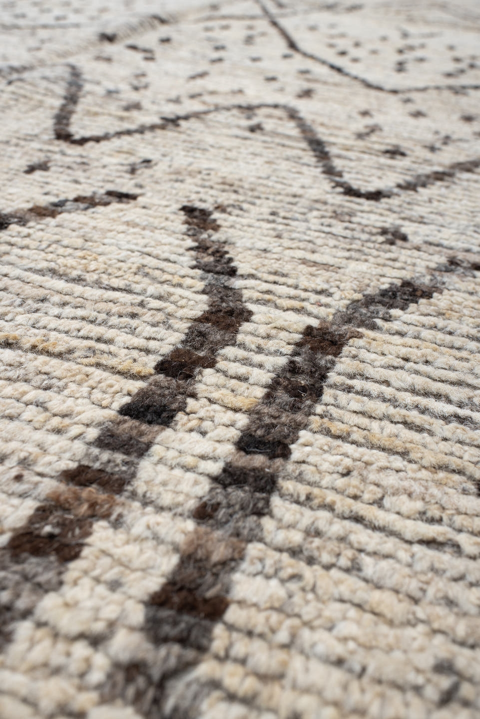 8' x 9' one-of-a-kind handmade vintage Tulu rug. Color palette: ivory, brown, taupe, charcoal, cream, beige, gray, black