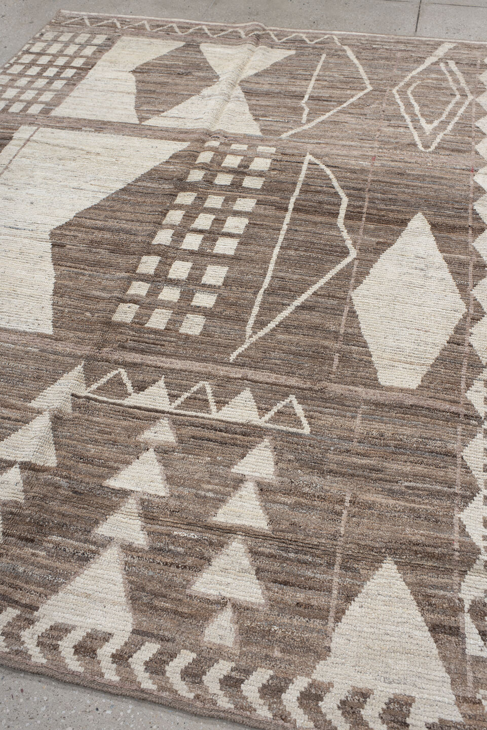 7' x 9' one-of-a-kind handmade vintage Tulu rug. Color palette: ivory, taupe, brown, charcoal, cream, rose, slate, pale blue
