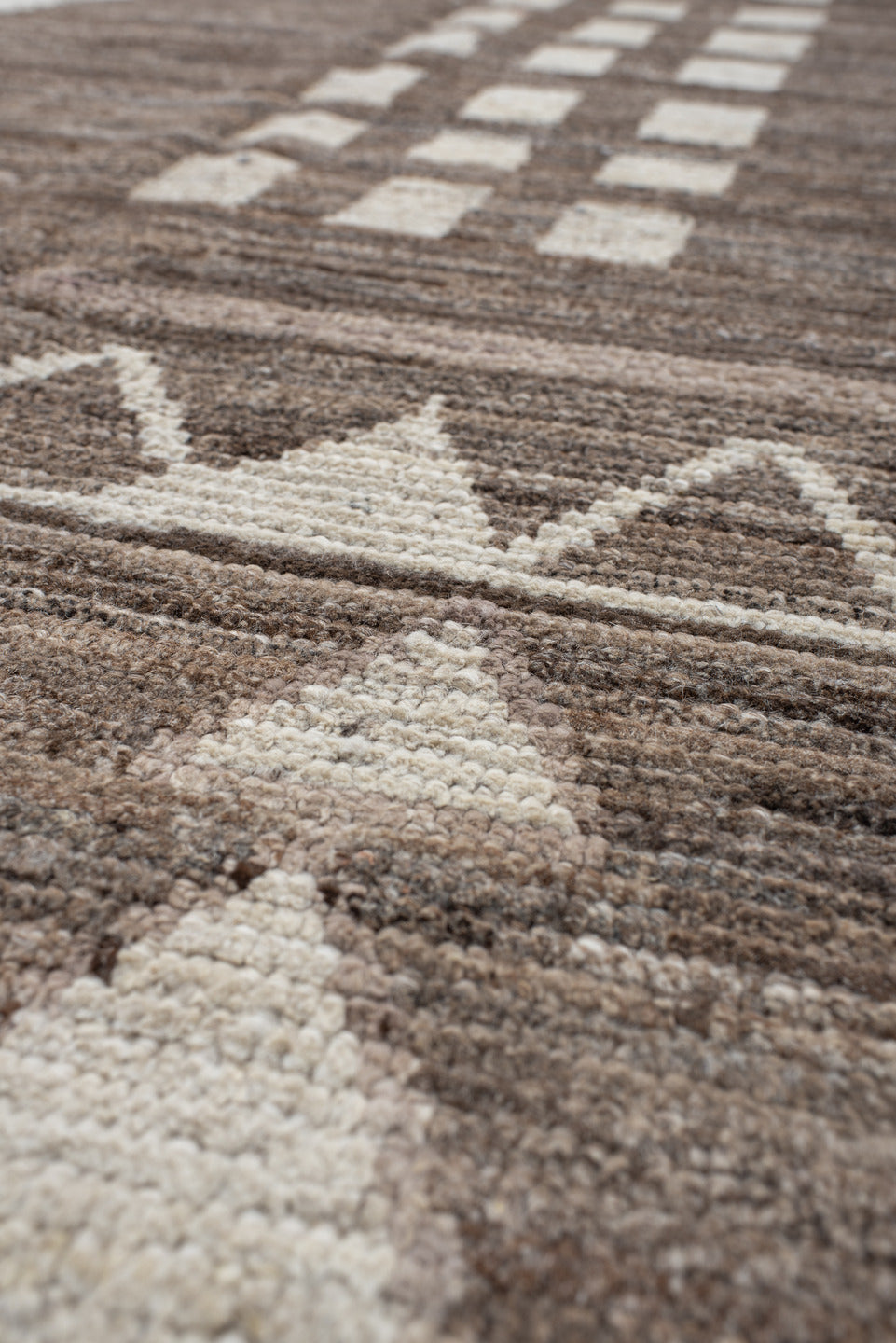 7' x 9' one-of-a-kind handmade vintage Tulu rug. Color palette: ivory, taupe, brown, charcoal, cream, rose, slate, pale blue