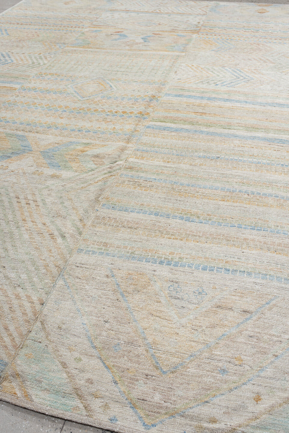 9' x 13' one-of-a-kind handmade vintage Tulu large size rug. Color palette: ivory, pale blue, sand, sage, peach, taupe