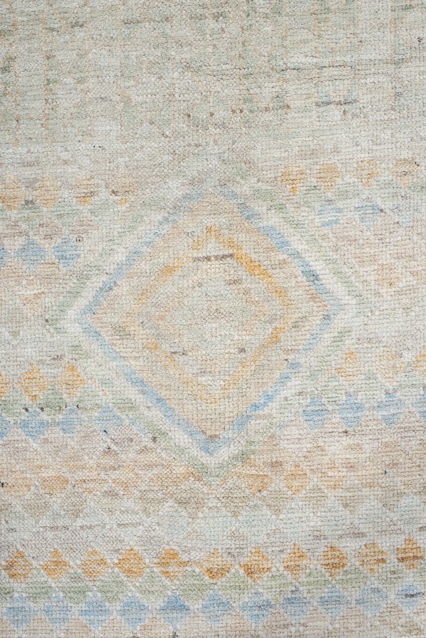 9' x 13' one-of-a-kind handmade vintage Tulu large size rug. Color palette: ivory, pale blue, sand, sage, peach, taupe