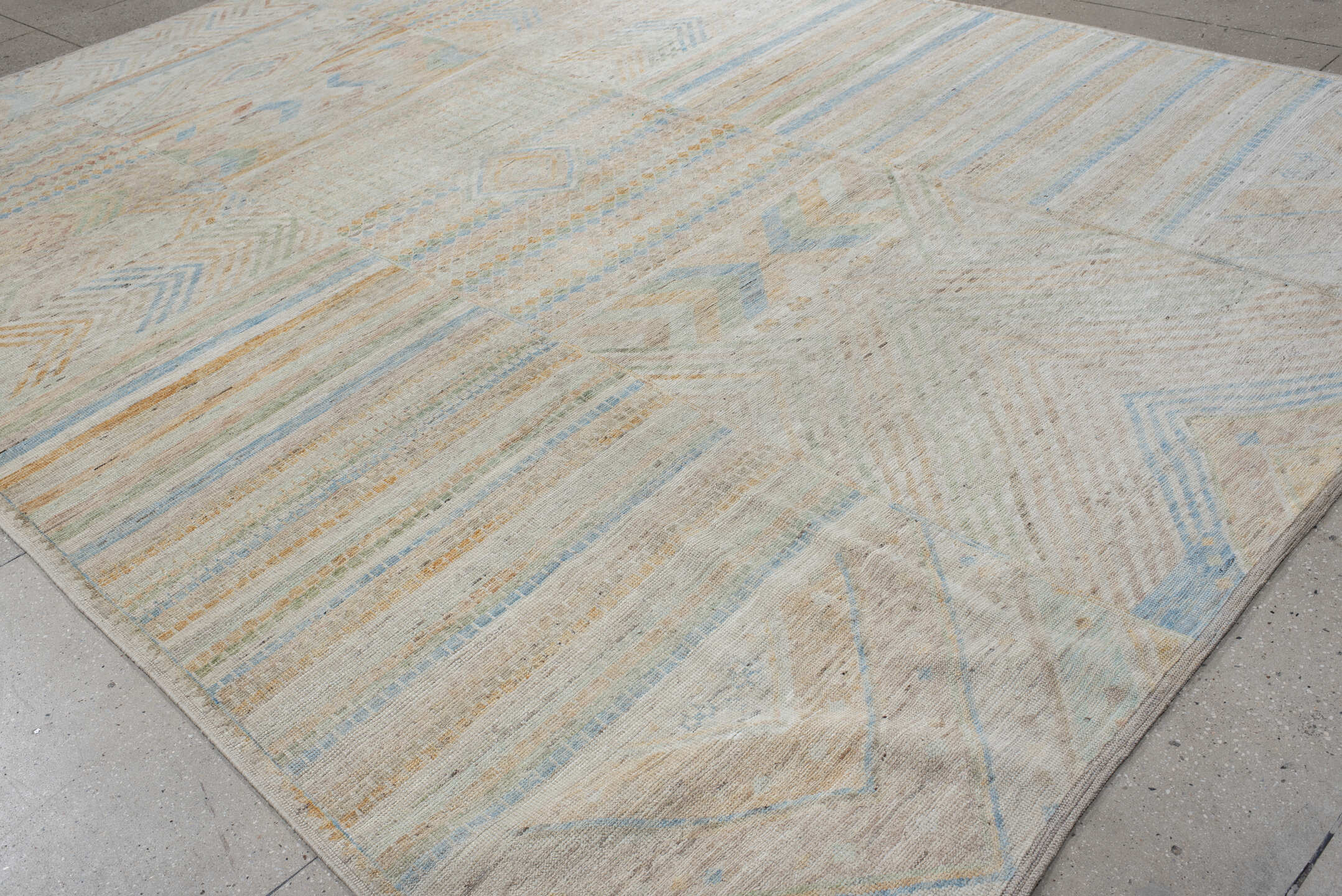 9' x 13' one-of-a-kind handmade vintage Tulu large size rug. Color palette: ivory, pale blue, sand, sage, peach, taupe