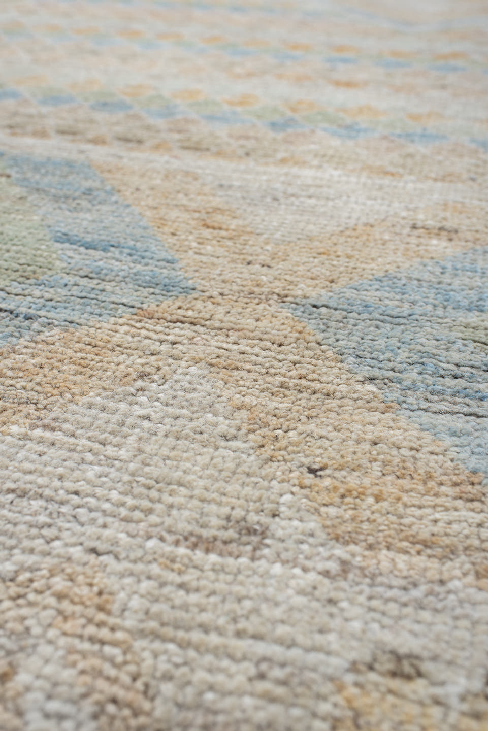 9' x 13' one-of-a-kind handmade vintage Tulu large size rug. Color palette: ivory, pale blue, sand, sage, peach, taupe