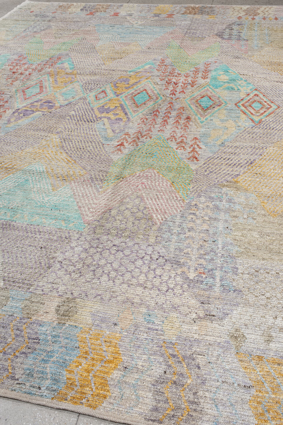 9' x 13' one-of-a-kind handmade vintage Tulu large size rug. Color palette: ivory, lavender, aqua, blush, saffron, coral