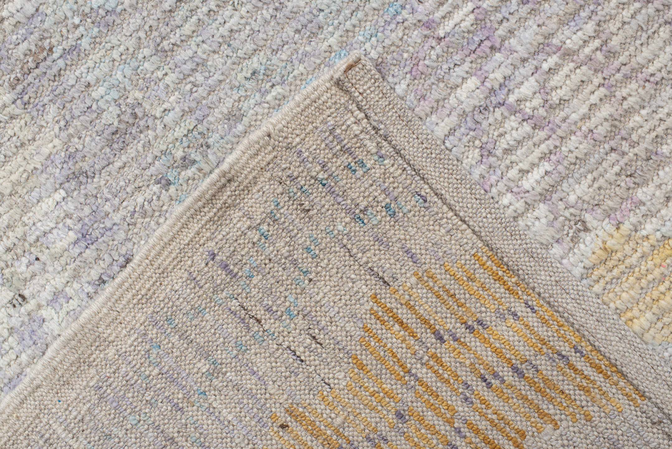 9' x 13' one-of-a-kind handmade vintage Tulu large size rug. Color palette: ivory, lavender, aqua, blush, saffron, coral