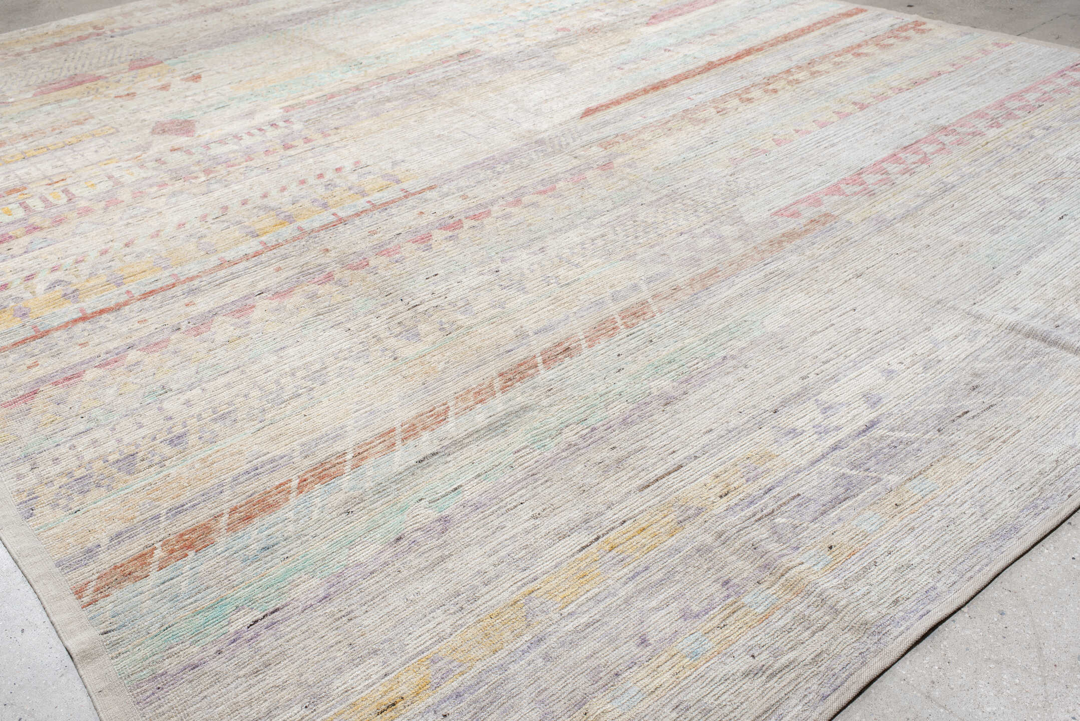 13' x 19' one-of-a-kind handmade vintage Tulu oversize rug. Color palette: ivory, lavender, rose, aqua, pale yellow, coral