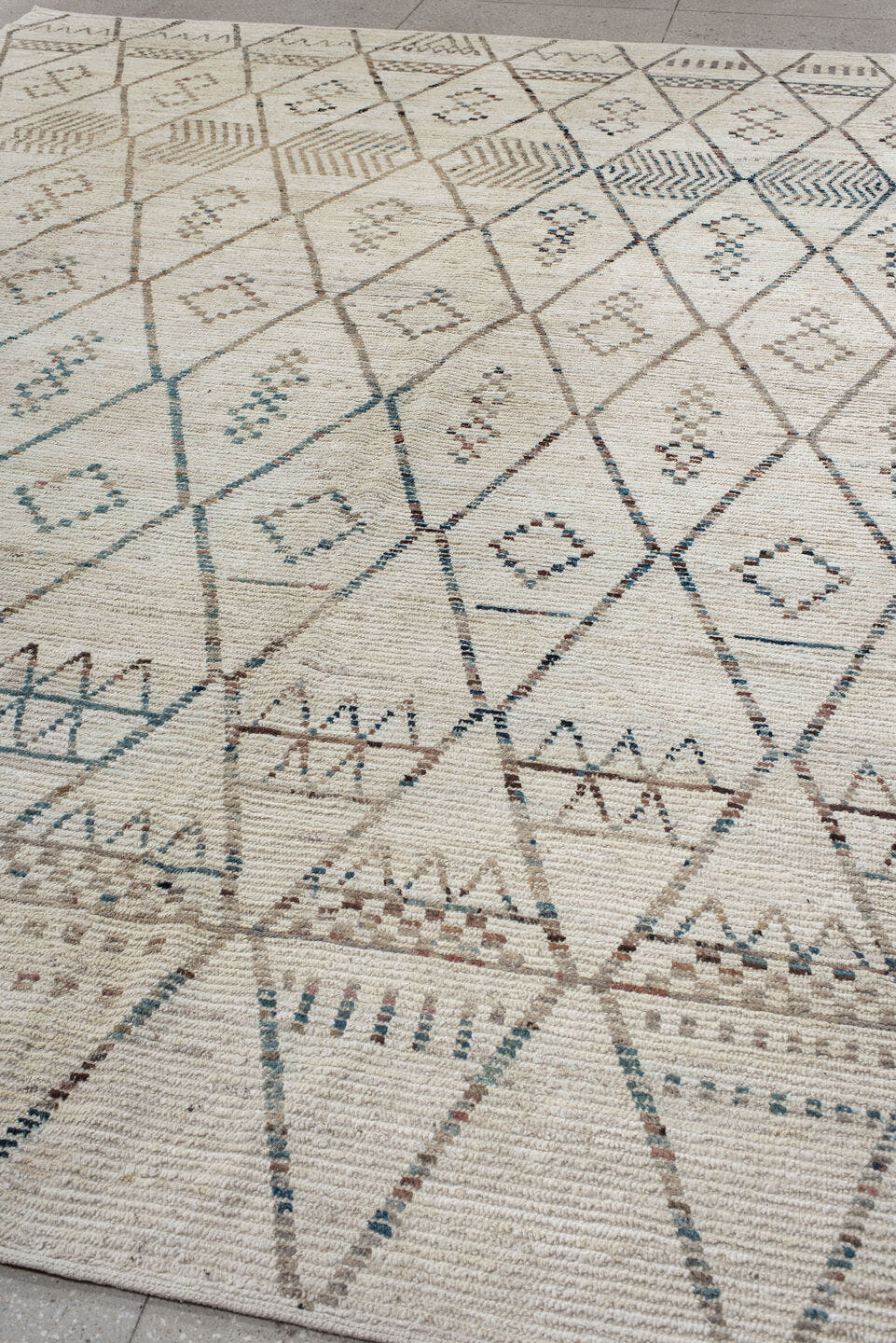 10' x 13' one-of-a-kind handmade vintage Tulu large size rug. Color palette: ivory, taupe, blue, beige, charcoal, brown