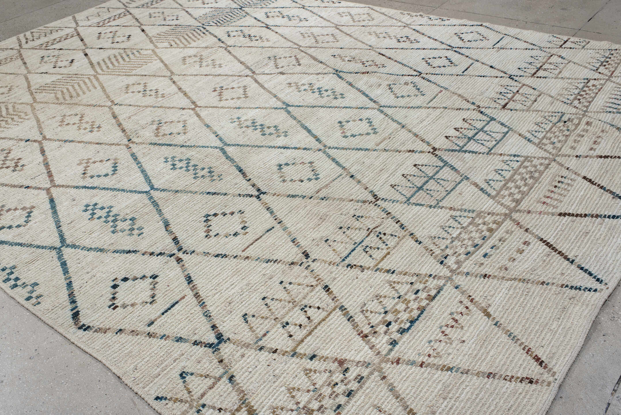 10' x 13' one-of-a-kind handmade vintage Tulu large size rug. Color palette: ivory, taupe, blue, beige, charcoal, brown