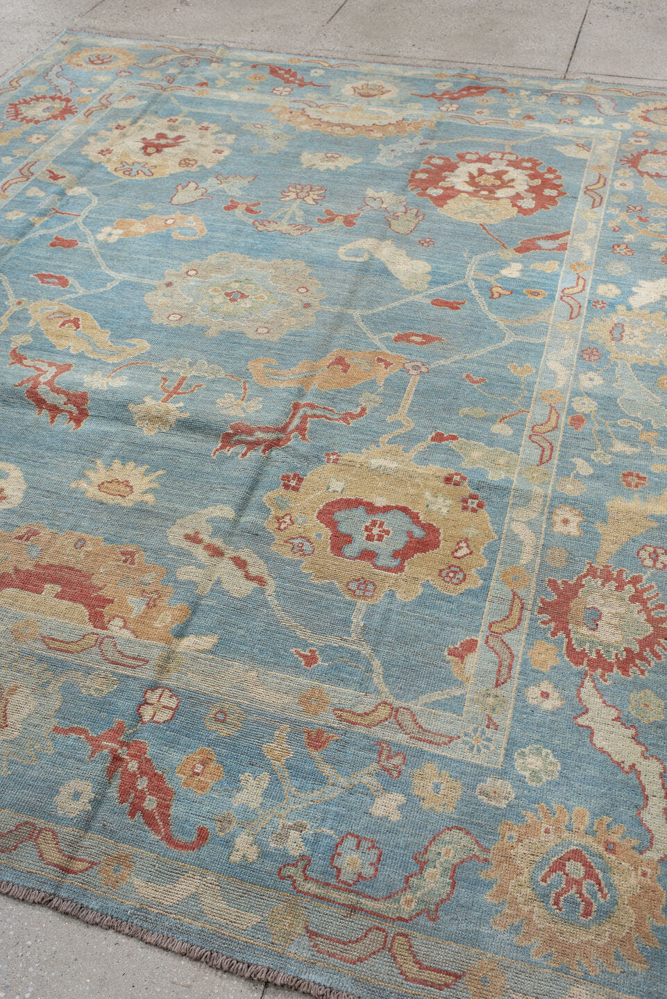7' x 9' one-of-a-kind handmade vintage Oushak rug. Color palette: sky blue, ivory, rust, blush, beige, sage, light blue