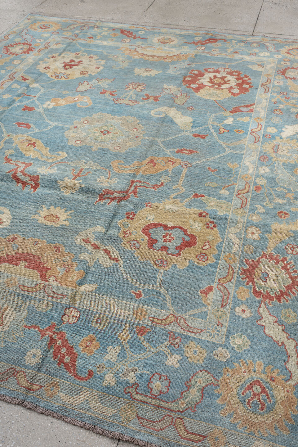 7' x 9' one-of-a-kind handmade vintage Oushak rug. Color palette: sky blue, ivory, rust, blush, beige, sage, light blue
