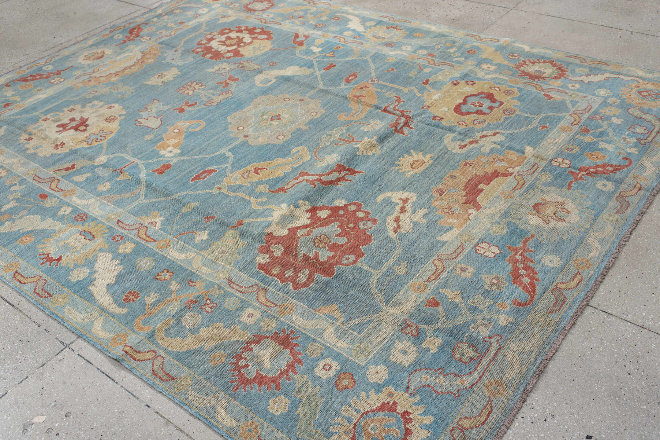 7' x 9' one-of-a-kind handmade vintage Oushak rug. Color palette: sky blue, ivory, rust, blush, beige, sage, light blue