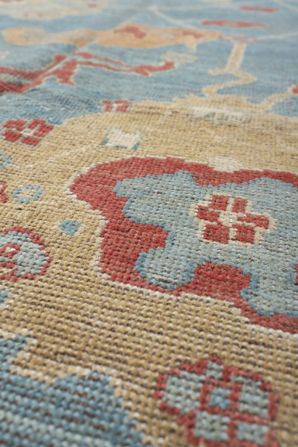 7' x 9' one-of-a-kind handmade vintage Oushak rug. Color palette: sky blue, ivory, rust, blush, beige, sage, light blue