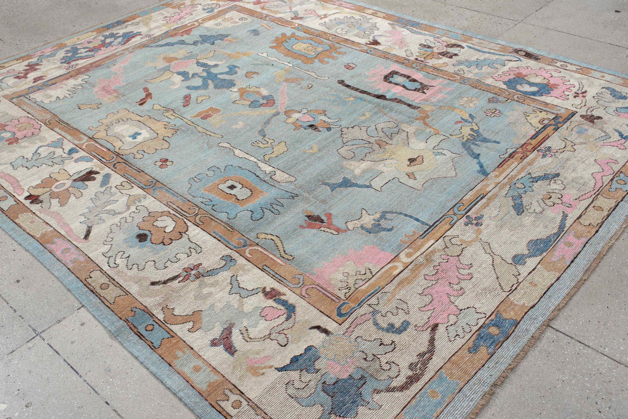 7' x 9' one-of-a-kind handmade vintage Oushak large size rug. Color palette: light blue, ivory, peach, pink, navy, taupe