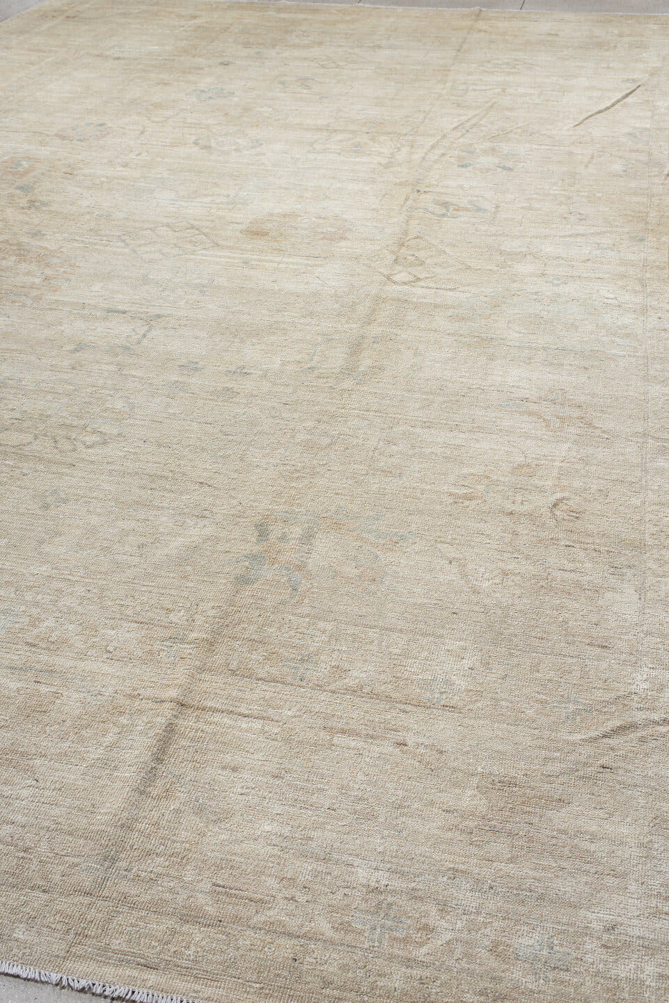 14' x 17' one-of-a-kind handmade vintage Tulu oversize rug. Color palette: ivory, beige, taupe, pale blue, cream, sand, gray