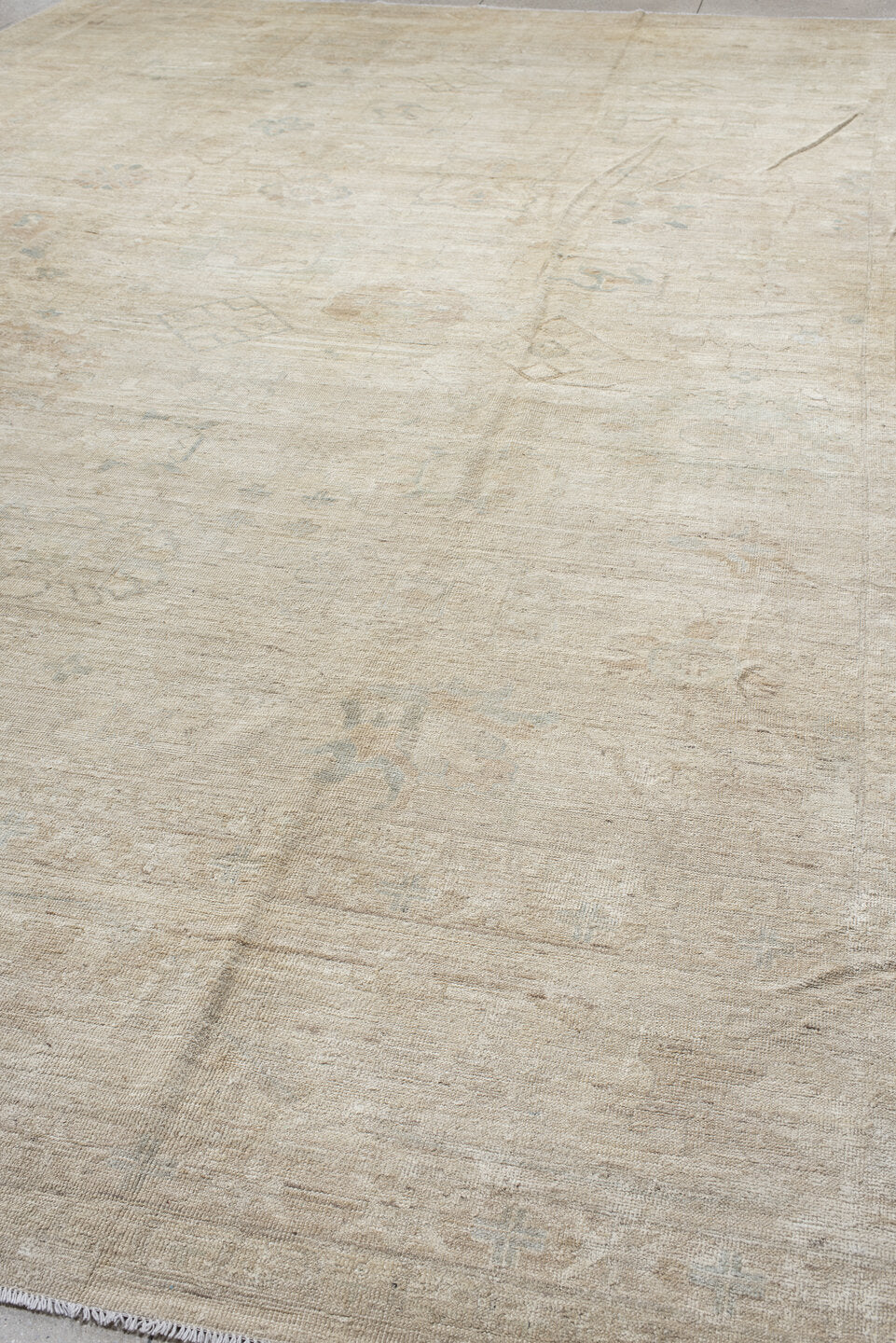 14' x 17' one-of-a-kind handmade vintage Tulu oversize rug. Color palette: ivory, beige, taupe, pale blue, cream, sand, gray