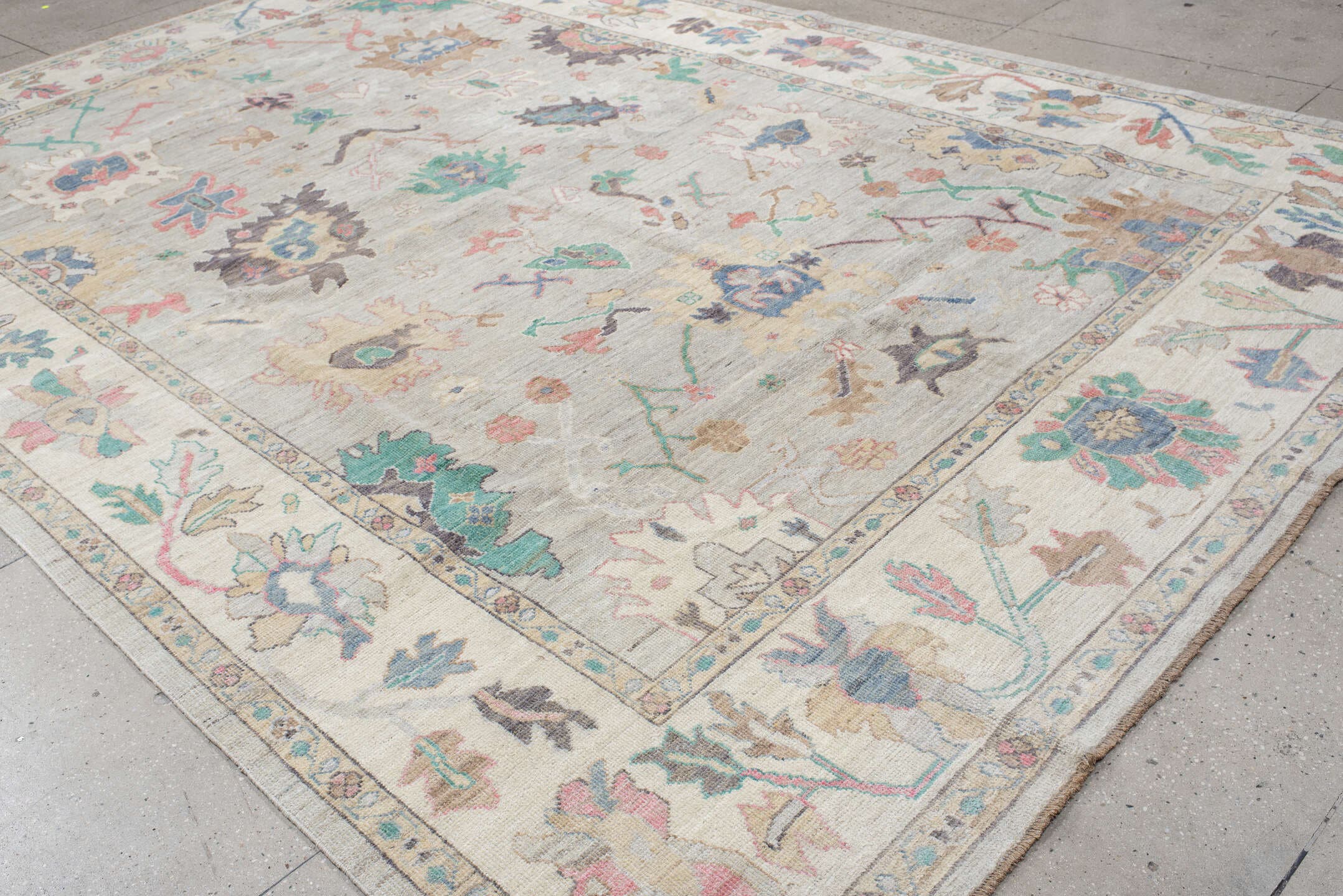 9' x 14' one-of-a-kind handmade vintage Oushak large size rug. Color palette: ivory, pale gray, aqua, coral, blue, sage
