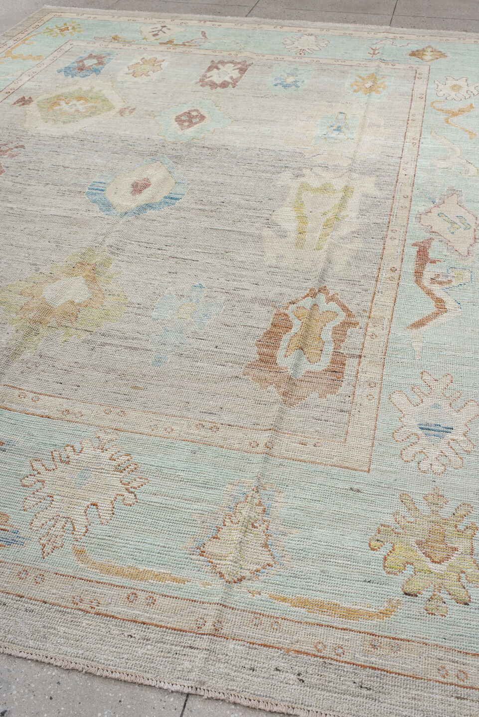 9' x 13' one-of-a-kind handmade vintage Oushak large size rug. Color palette: ivory, pale aqua, beige, sand, muted gold