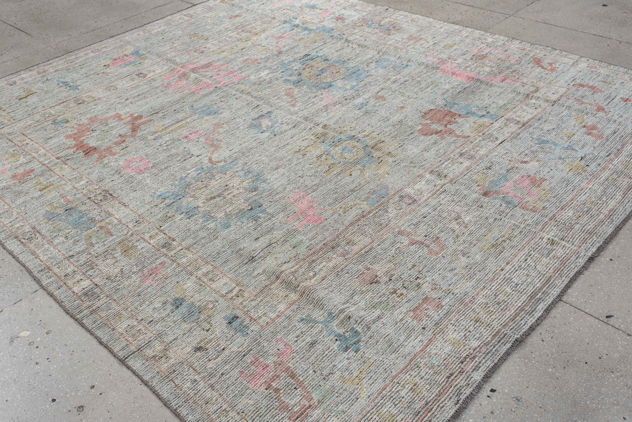 8' x 9' one-of-a-kind handmade vintage Oushak rug. Color palette: ivory, pale blue, blush, taupe, muted gold, terra cotta