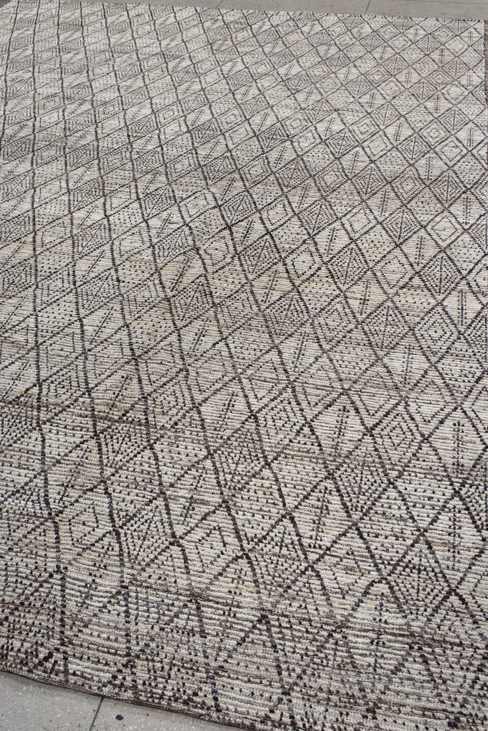 10' x 13' one-of-a-kind handmade vintage Tulu large size rug. Color palette: ivory, charcoal, taupe, brown, gray, black