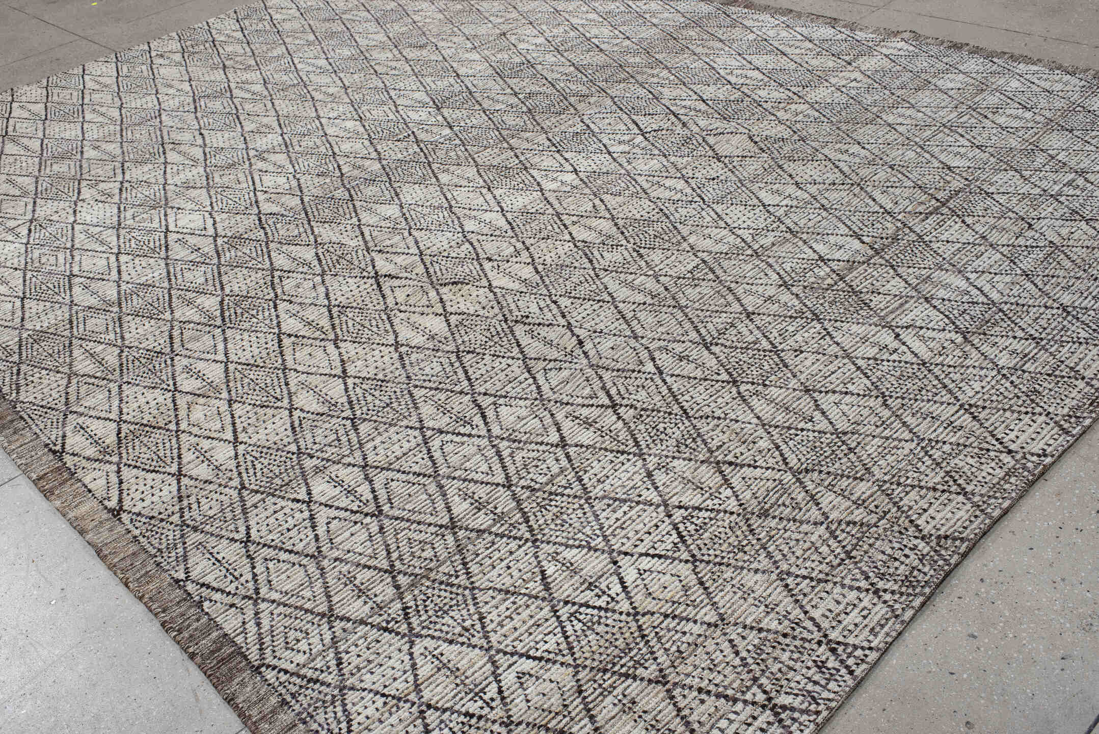 10' x 13' one-of-a-kind handmade vintage Tulu large size rug. Color palette: ivory, charcoal, taupe, brown, gray, black