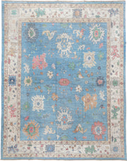 12' x 15' one-of-a-kind handmade vintage Oushak oversize rug. Color palette: sky blue, ivory, blush, sage, muted gold, taupe