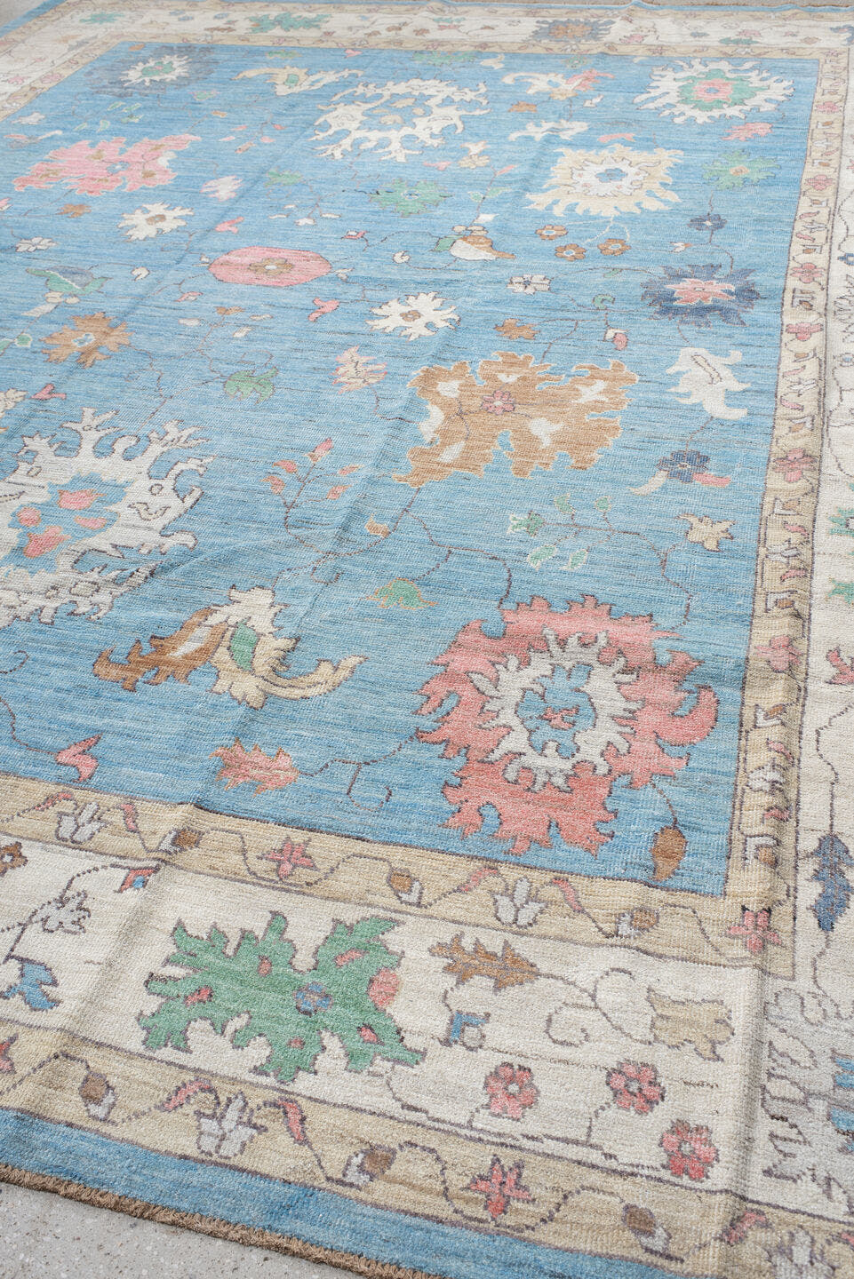 12' x 15' one-of-a-kind handmade vintage Oushak oversize rug. Color palette: sky blue, ivory, blush, sage, muted gold, taupe