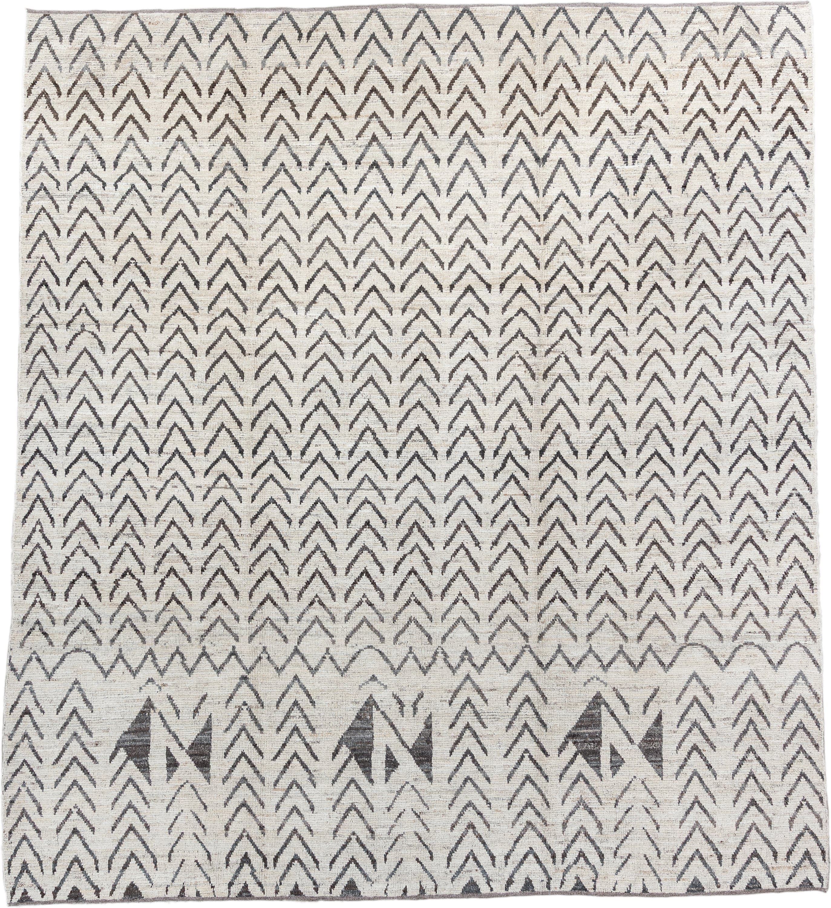 8' x 9' one-of-a-kind handmade vintage Tulu rug. Color palette: ivory, charcoal, taupe, gray, black, beige