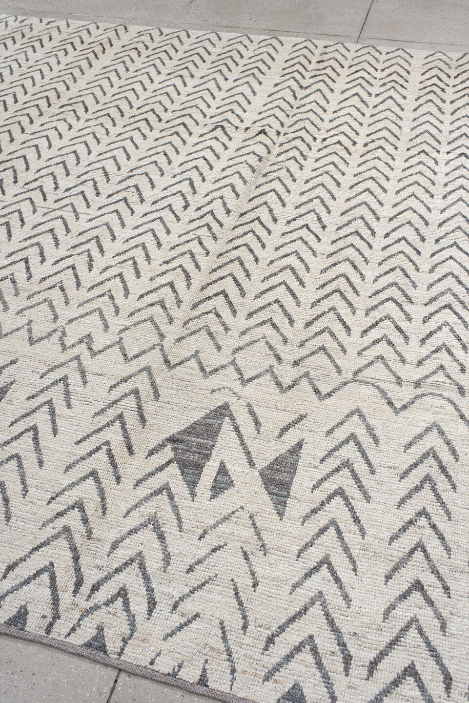 8' x 9' one-of-a-kind handmade vintage Tulu rug. Color palette: ivory, charcoal, taupe, gray, black, beige