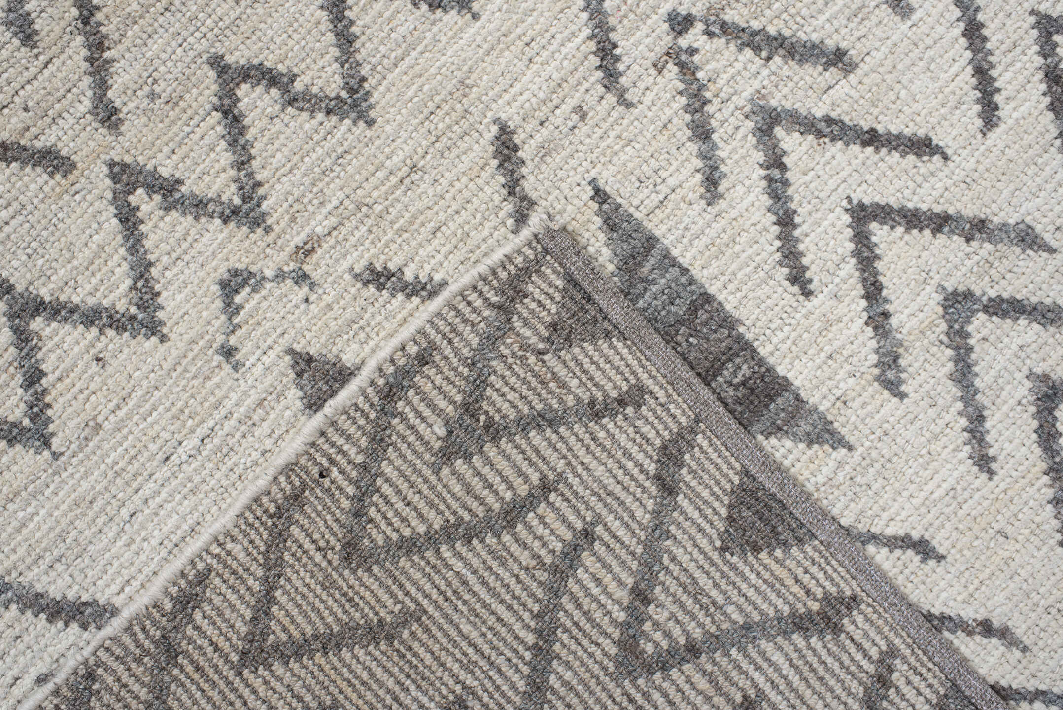 8' x 9' one-of-a-kind handmade vintage Tulu rug. Color palette: ivory, charcoal, taupe, gray, black, beige