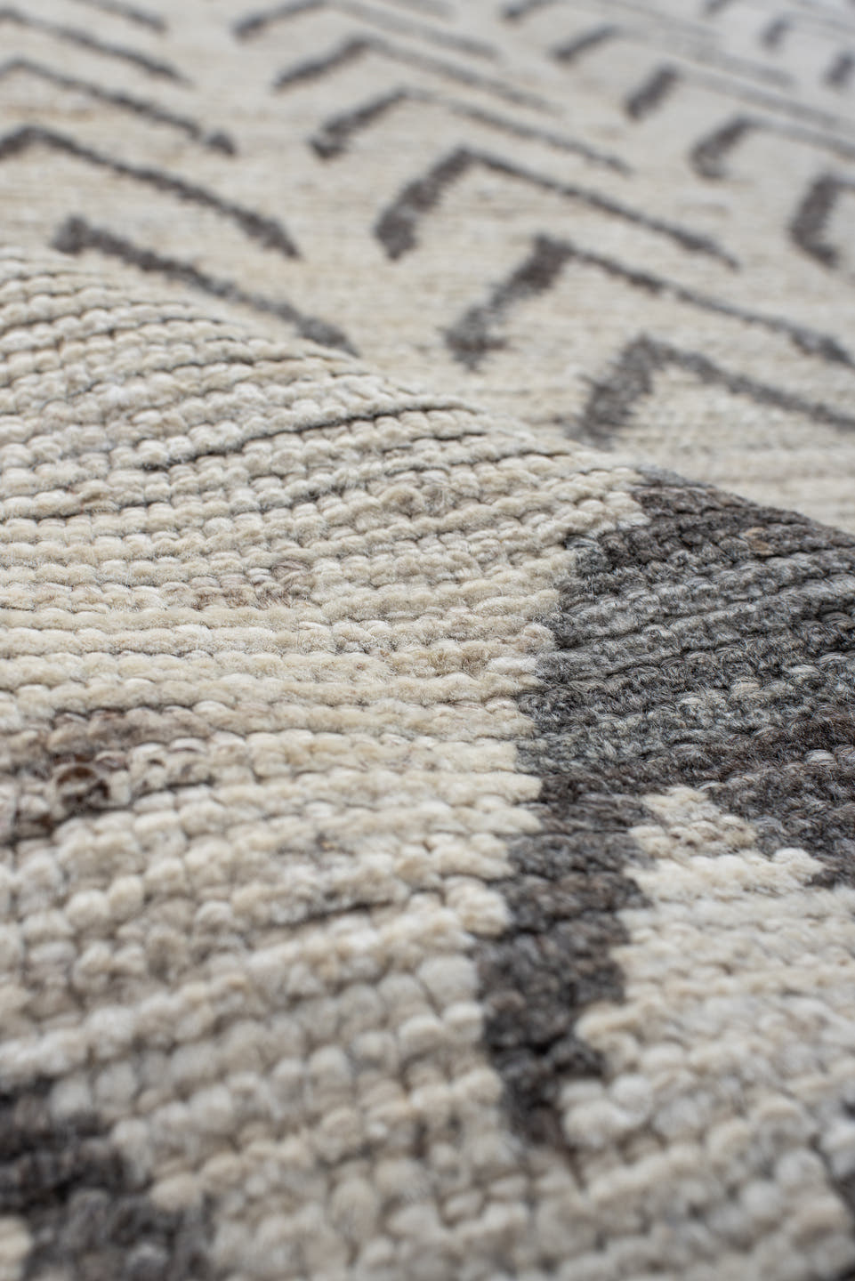8' x 9' one-of-a-kind handmade vintage Tulu rug. Color palette: ivory, charcoal, taupe, gray, black, beige