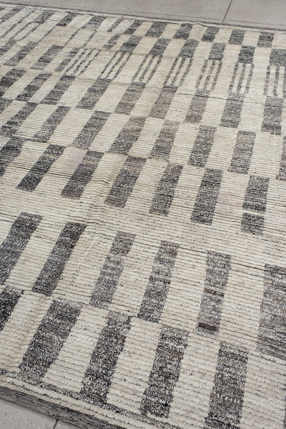 8' x 9' one-of-a-kind handmade vintage Tulu rug. Color palette: ivory, charcoal, gray, black