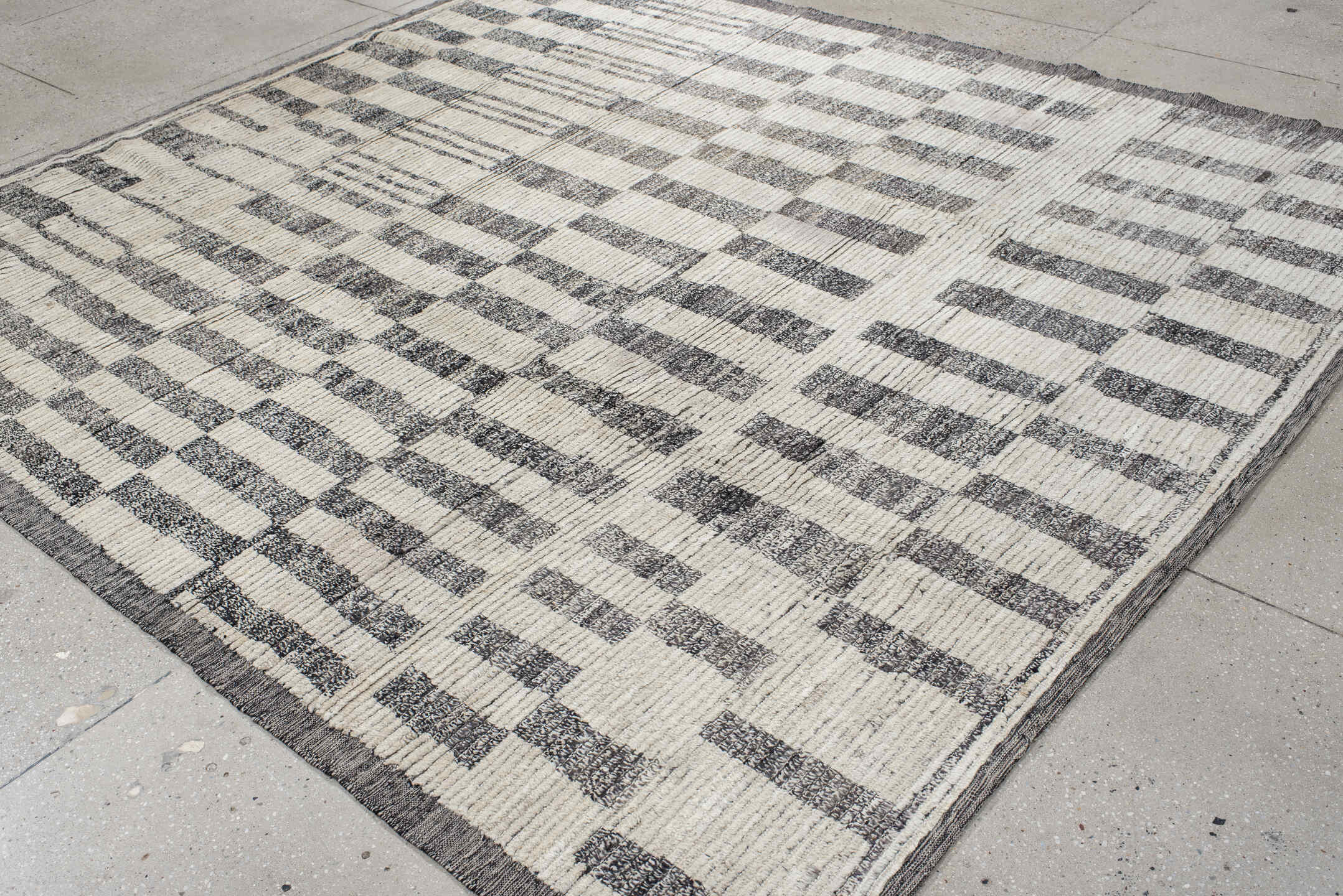 8' x 9' one-of-a-kind handmade vintage Tulu rug. Color palette: black, charcoal, dim gray, gray, light gray, linen