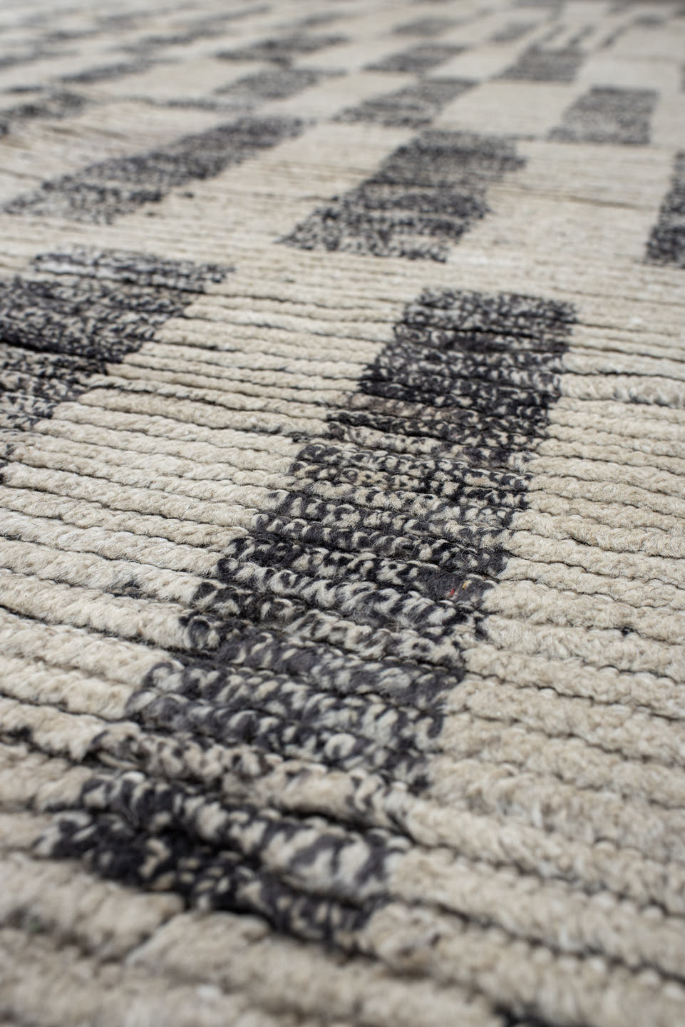 8' x 9' one-of-a-kind handmade vintage Tulu rug. Color palette: ivory, charcoal, gray, black